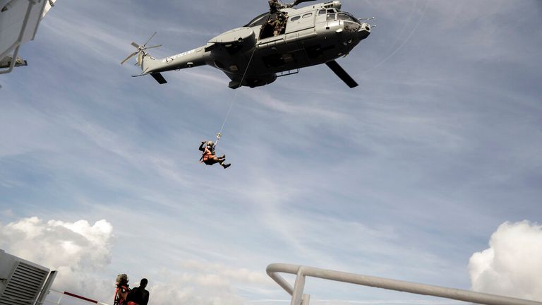 The French Coast Guard helping migrants evacuate the humanitarian ship Ocean Viking Pic: AP 