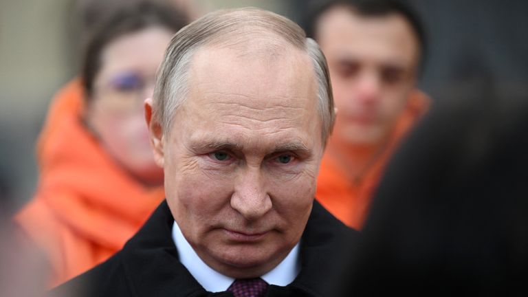 Russian President Vladimir Putin speaks with members of public associations, youth and volunteer organizations during a flower-laying ceremony at the monument to Kuzma Minin and Dmitry Pozharsky while marking Russia&#39;s Day of National Unity in Red Square in central Moscow, Russia 