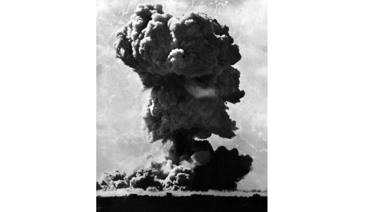 A dust cloud rises from a British nuclear bomb test in 1952 in Maralinga in 1952. Pic: AP