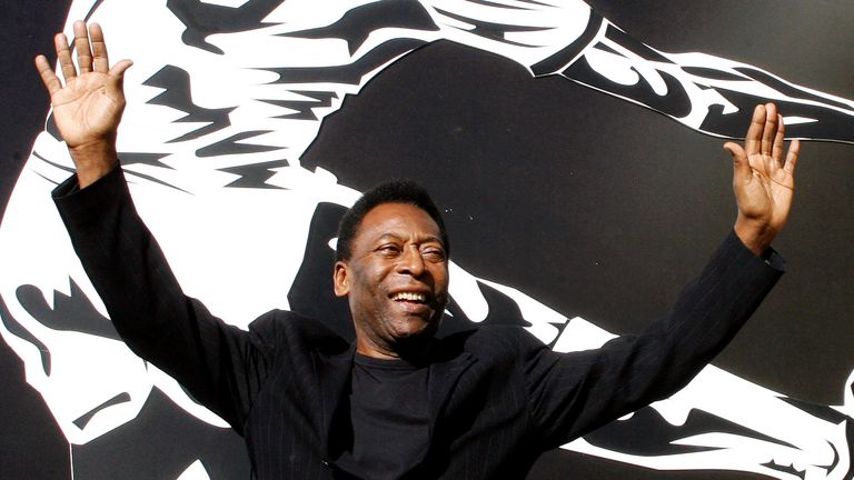 FILE PHOTO: Brazilian soccer legend Pele poses for photographers before a news conference on an exhibition about his life called "The Marks of the King" which is being held in conjunction with celebrations commemorating the 50th anniversary of Brazil&#39;s World Cup victory at the National Museum in Brasília June 25, 2008. REUTERS/Roberto Jayme/File Photo