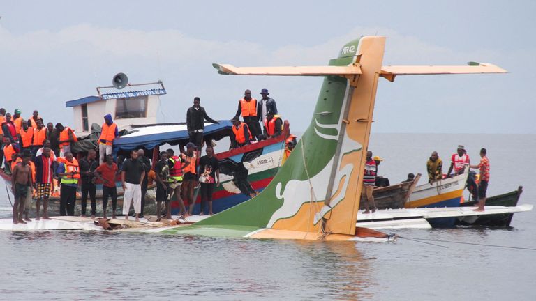 Rescuers attempt to recover the Precision Air passenger plane that crashed into Lake Victoria in Bukoba, Tanzania