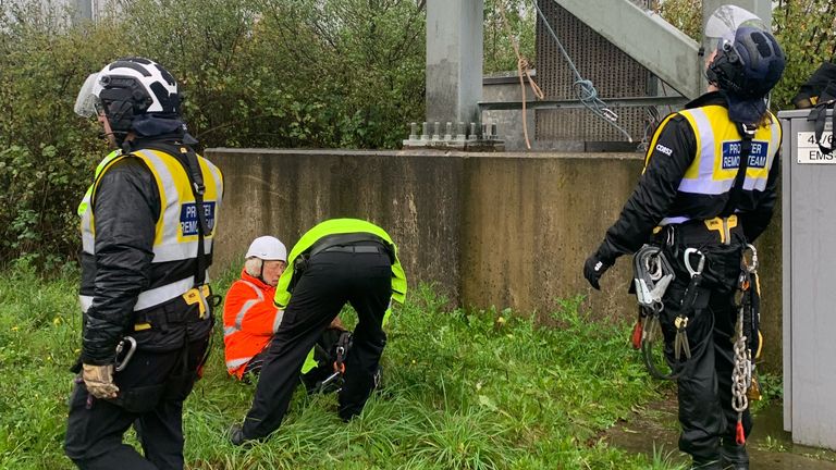 A protester is removed from an overhead gantry at J6 of the M25 motorway, London. Pic: Surrey Police