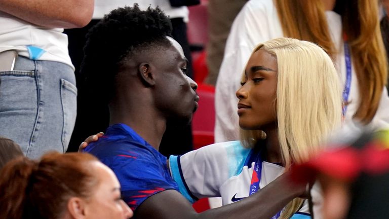 England&#39;s Bukayo Saka with his partner Tolami Benson after the match during the FIFA World Cup Group B match at the Ahmad Bin Ali Stadium, Al Rayyan, Qatar. Picture date: Tuesday November 29, 2022.