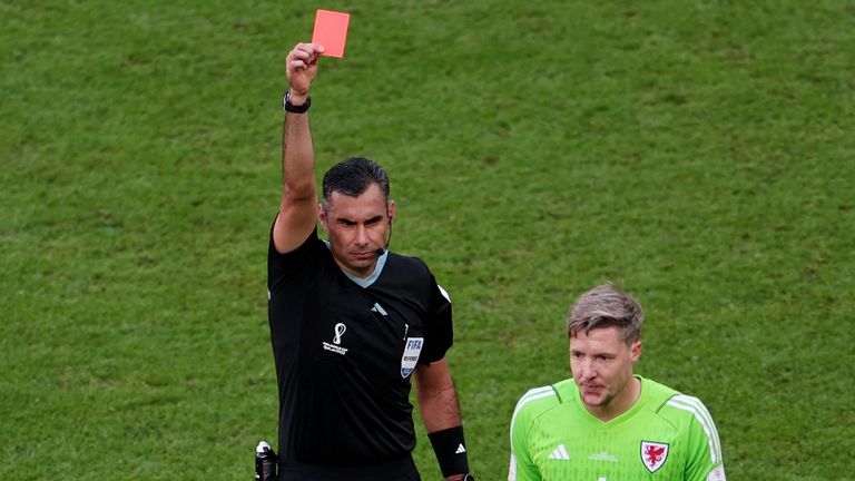 Football Soccer - Qatar 2022 FIFA World Cup - Group B - Wales v Iran - Ahmad Bin Ali Stadium, Al Rayyan, Qatar - 25 November 2022 Wales' Wayne Hennessey is booked by referee Mario Escobar red REUTERS/Marko Djurica