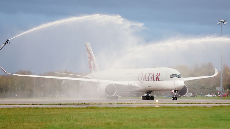 Soccer Football - FIFA World Cup Qatar 2022 - Wales Departure for Qatar - Cardiff Airport, Cardiff, Wales, Britain - November 15, 2022 A water arch washes over the flight of the Wales team as they depart for the FIFA World Cup Qatar 2022 action pictures via Reuters/Matthew Childs