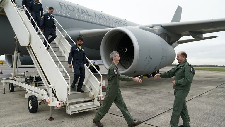Embargoed until Friday 18 November 1800 Chief of the Air Staff, Air Marshal Sir Mike Wigston (right) welcomes Flight Test Engineer Flight Lieutenant Nick Durnell (second from right) and the rest of the crew as they aboard a RAF Voyager then disembarked to take part in the world's first flight on 100% sustainable aviation fuel at RAF Brize Norton, Oxfordshire, UK, using a large aircraft. Image date: Wednesday 16 November 2022.