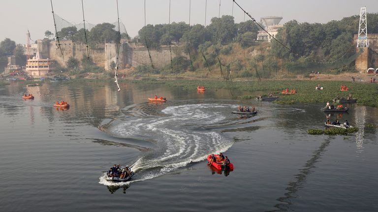 Rescuers conduct search operation after a suspension bridge collapsed on Sunday, in Morbi town in the western state of Gujarat, India, November 1, 2022. REUTERS/Stringer NO RESALES. NO ARCHIVES.
