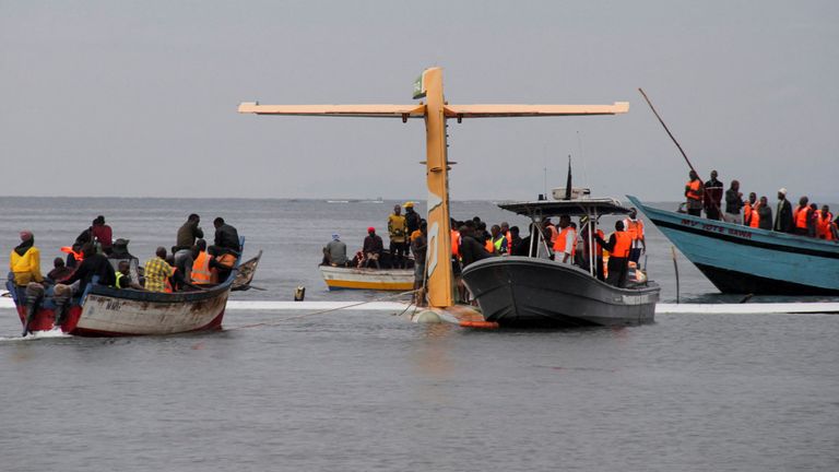 Rescuers attempt to recover the Precision Air passenger plane that crashed into Lake Victoria in Bukoba, Tanzania