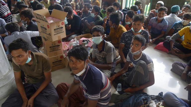 Ethnic Rohingya refugees gather at a makeshift shelter in North Aceh, Indonesia, Tuesday, November 15, 2022. More than 100 Rohingya Muslims traveling in a boat have been found along the coast of the Indonesian province of Aceh on Tuesday.  (AP Photo / Rahmat Mirza)