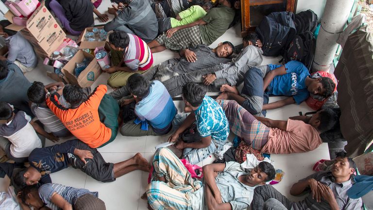 Ethnic Rohingya refugees rest at a temporary shelter in North Aceh, Indonesia, Tuesday, Nov. 15, 2022. More than 100 Rohingya Muslims traveling in a boat were found along the coast of Indonesia...s Aceh province on Tuesday. (AP Photo/Zik Maulana)