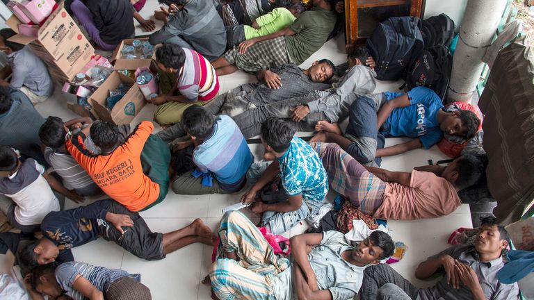 Ethnic minority Rohingya refugees rest at a temporary shelter in North Aceh, Indonesia, Tuesday, November 15, 2022. More than 100 Rohingya Muslims traveling in a boat have been found along. coast of Indonesia's Aceh province on Tuesday.  (AP Photo / Zik Maulana)