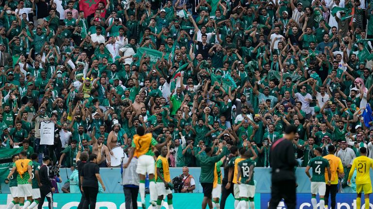 Saudi Arabia fans celebrate their victory. Pic: AP