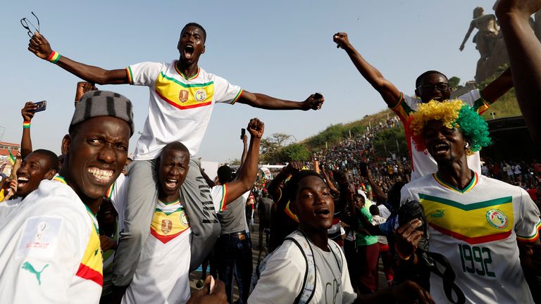 Soccer Football - FIFA World Cup Qatar 2022 - Fans in Dakar watch Ecuador v Senegal - Dakar, Senegal - November 29, 2022 Senegal fans celebrate after Senegal&#39;s Kalidou Koulibaly scores their second goal REUTERS/Zohra Bensemra