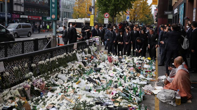 Cabinet members, accompanying South Korean President Yoon Suk-yeol, pay tribute to the victims during a visit to the scene of a crowd crush that happened during Halloween festivities, in Seoul, South Korea, November 1, 2022. REUTERS/Kim Hong-Ji