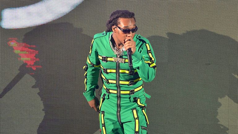 Migos Takeoff performs PIC: AP on stage during the Drake Aubrey and three Migos tour at American Airlines Arena on November 13, 2018