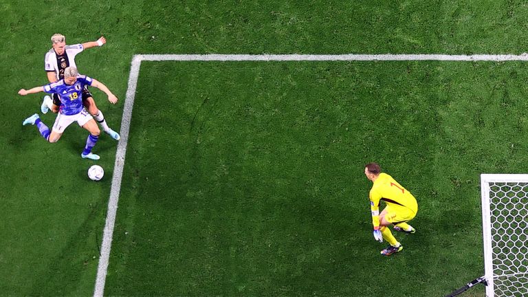 Soccer Football - FIFA World Cup Qatar 2022 - Group E - Germany v Japan - Khalifa International Stadium, Doha, Qatar - November 23, 2022 Japan&#39;s Takuma Asano scores their second goal past Germany&#39;s Manuel Neuer REUTERS/Matthew Childs