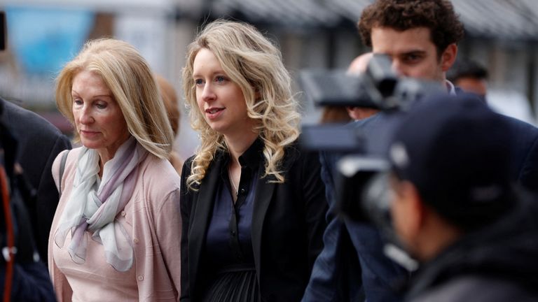 Theranos founder Elizabeth Holmes arrives with her family and partner Billy Evans to be sentenced. Pic: AP