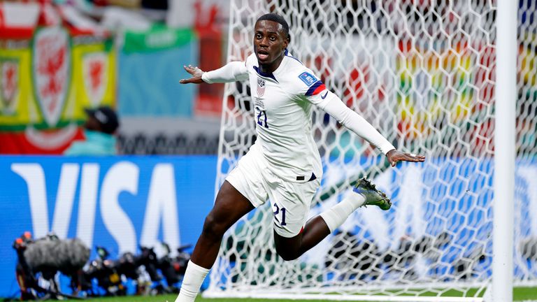 November 21, 2022;  Al Rayyan, Qatar;  United States of America forward Timothy Weah (21) reacts after scoring a goal against Wales during the first half during a group stage match during the 2022 FIFA World Cup at the Ahmed Bin Ali Stadium.  Mandatory Credit: Yukihito Taguchi-USA TODAY Sport