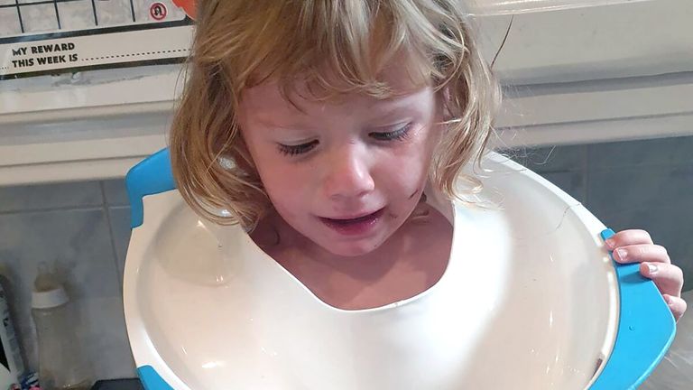 Photo issued by Tyne and Wear Fire and Rescue Service of Harper, 2, with a potty stuck on her neck which had to be freed by firefighters from Tyne and Wear Fire and Rescue Service. Issue date: Thursday November 3, 2022.