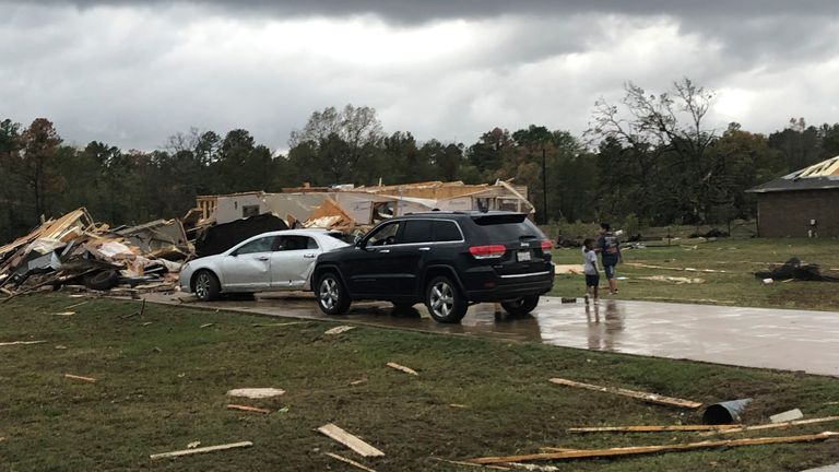 Scenes of devastation are visible in all directions along Lamar County Road 35940, west of State Highway 271, after a massive tornado hit the area, causing extensive damage and destroying an unknown number of homes, Friday, Nov. 4, 2022 in Powderly, Texas. (Jeff Forward/The Paris News via AP)