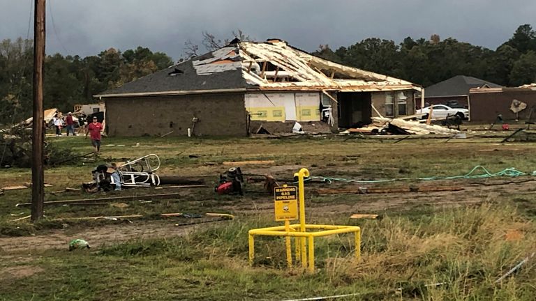 Scenes of devastation are visible in all directions along Lamar County Road 35940, west of State Highway 271, after a massive tornado hit the area, causing extensive damage and destroying an unknown number of homes, Friday, Nov. 4, 2022 in Powderly, Texas. (Jeff Forward/The Paris News via AP)