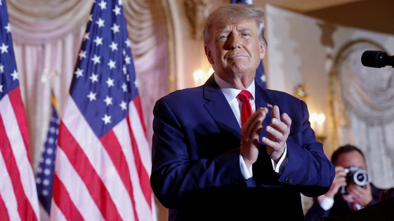 Former US President Donald Trump holds on as he announces he will once again run for President of the United States in the 2024 US presidential election during an event at his Mar-a-Lago estate in Palm Beach, Florida, USA , on November 15, 2022. REUTERS/Jonathan Ernesto