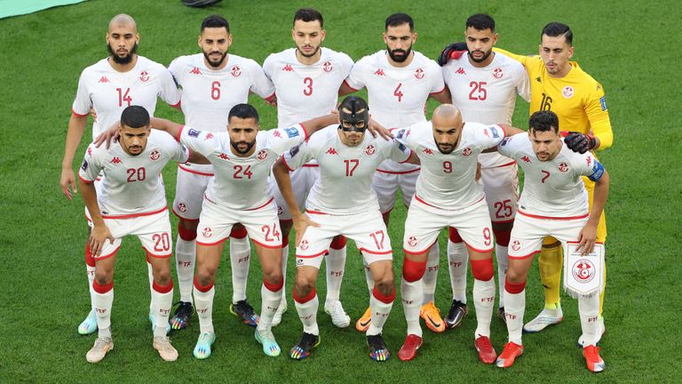 Tunisia players pose for a team group photo before the match 