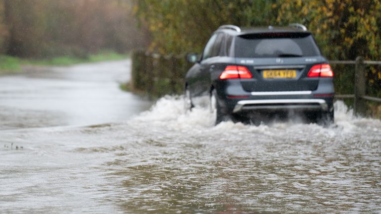 A motorist drives along a flooded road in Mountsorrel, Leicestershire. Motorists are being warned to stay off the roads as cars have become stuck in flood water caused by downpours and the UK prepares to suffer "miserable conditions" over the next two days. Picture date: Thursday November 17, 2022.