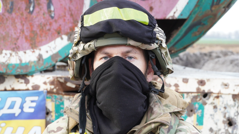 Private Uri covers his face because his family are still trapped in occupied territory