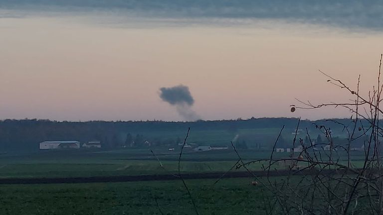 Smoke rises in the distance following reports of two explosions. Pic: Stowarzyszenie Moje Nowosiolki/Reuters