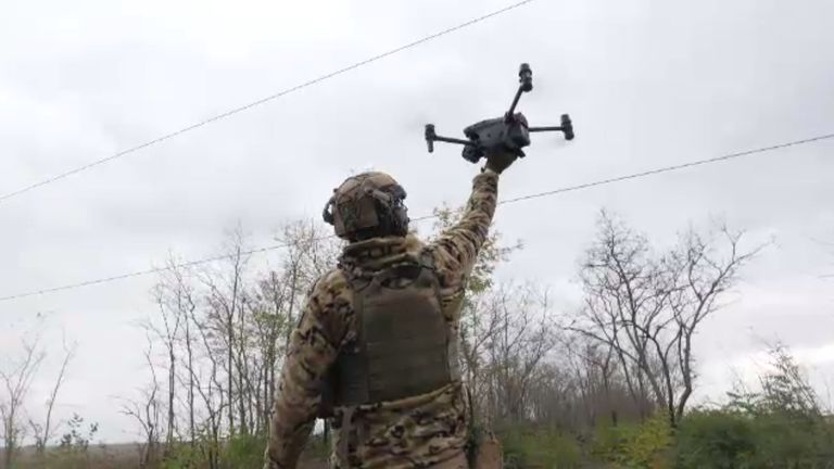 A Ukrainian drone pilot launches his equipment