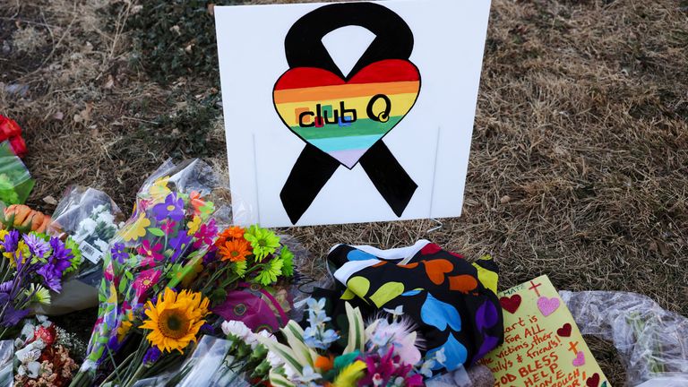 Floral tributes are placed in memory of the victims after a mass shooting at the Club Q gay nightclub in Colorado Springs, Colorado, U.S. November 20, 2022. REUTERS/Kevin Mohatt