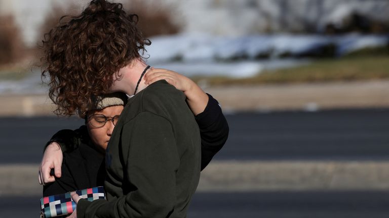 People react after a mass shooting at the Club Q gay nightclub in Colorado Springs, Colorado, U.S., November 20, 2022. REUTERS/Kevin Mohatt