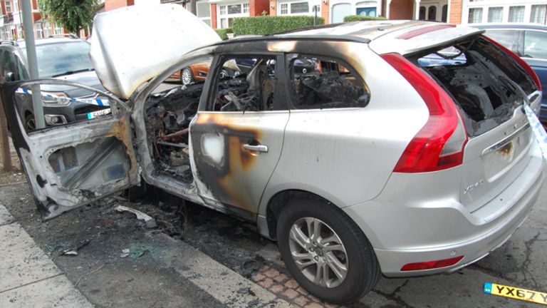One of the burnt-out cars