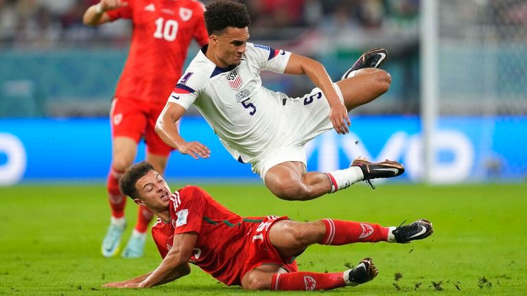 USA's Antonee Robinson flies over Wales' Ethan Ampadu during the match