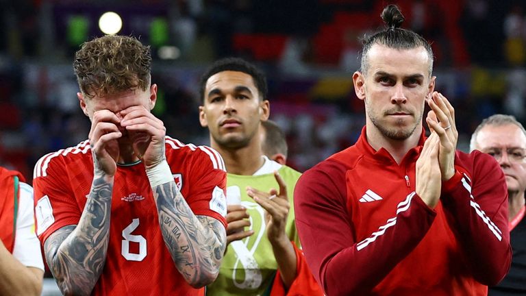 Soccer Football - FIFA World Cup Qatar 2022 - Group B - Wales v England - Ahmad Bin Ali Stadium, Al Rayyan, Qatar - November 29, 2022 Wales' Gareth Bale and Joe Rodon look dejected after the match as Wales are eliminated from the World Cup REUTERS/Lee Smith TPX IMAGES OF THE DAY
