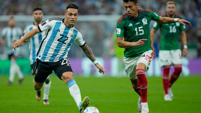 Lautaro Martinez and Hector Moreno in action at the Lusail Stadium