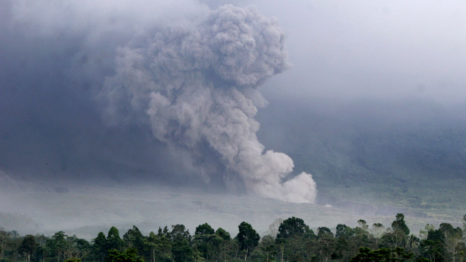 Indonesia volcano eruption spews lava rivers and 50,000ft high ash plume | World News