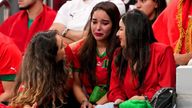 A Morocco fan is comforted in the stands