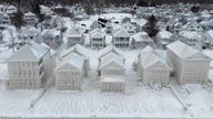 In this image taken by drone, houses along the shores of Lake Erie, near Fort Erie, Ontario, remain covered in ice Tuesday, Dec. 27, 2022, following a winter storm that swept through much of Ontario. PIC:Canadian Press/AP