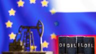 Models of oil barrels and a pump jack are seen in front of displayed EU and Russia flag colours in this illustration taken March 8, 2022. 
