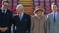 King Charles and Camilla were greeted by Hollywood royalty during a visit to Wrexham AFC 