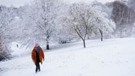 A person walks in the snow at Greenwich Park, London. Snow and ice have swept across parts of the UK, with cold wintry conditions set to continue for days. Picture date: Monday December 12, 2022.