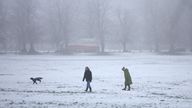 People walk their dogs in freezing temperatures in Knutsford, Britain, December 12, 2022. REUTERS/Phil Noble