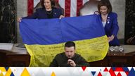 US Vice President Kamala Harris and House Speaker Nancy Pelosi with a Ukraine flag presented by Ukrainian President Volodymyr Zelenskyy. Pic: AP