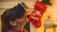 Little Girl Using Virtual Reality Simulator on Christmas stock photo