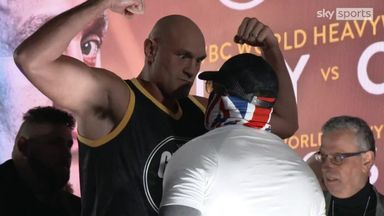 Fury glowers down at masked Chisora in tense face-off