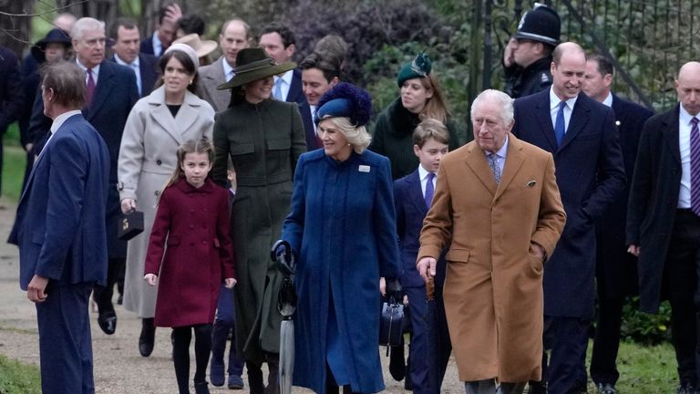 King Charles III, centre, right, and Camilla, the Queen Consort lead the Royal Family as they arrive to attend the Christmas day service at St Mary Magdalene Church in Sandringham in Norfolk, England, Sunday, Dec. 25, 2022. (AP Photo/Kirsty Wigglesworth)
