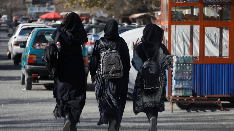 Afghan female students walk near Kabul University in Kabul, Afghanistan, December 21, 2022. REUTERS/Ali Khara
