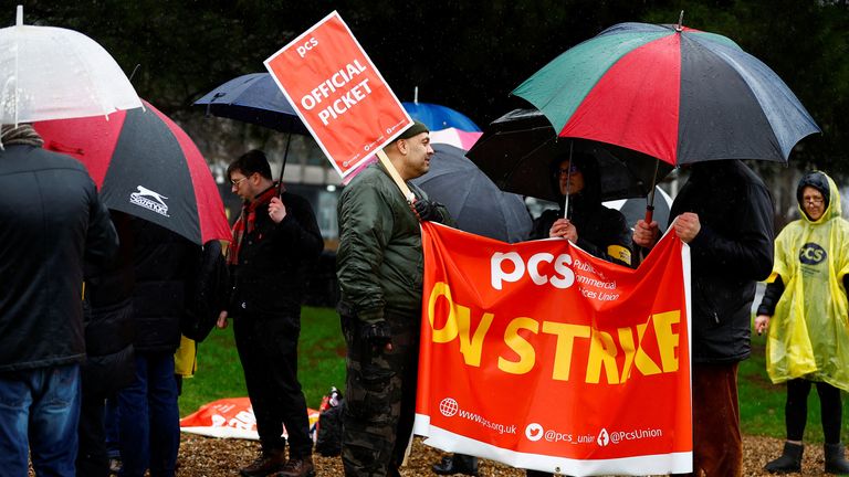 Members of the Public and Commercial Services (PCS) Union take part in a border force workers strike action near Heathrow Airport